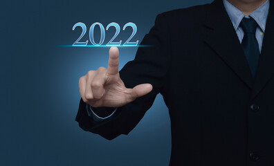 Businessman pressing 2022 text over light gradient blue background, Happy new year 2022 calendar cover concept