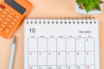 October 2021 desk calendar with calculator.