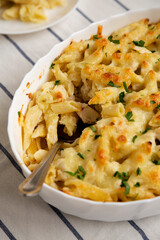 Homemade Chicken Alfredo Pasta Bake with Parsley, side view. Close-up.