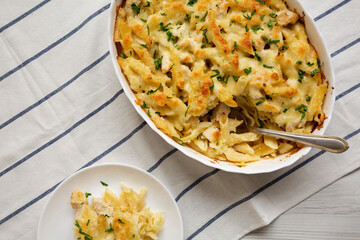 Homemade Chicken Alfredo Pasta Bake with Parsley, overhead view. Flat lay, top view, from above....