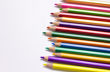 Fototapeta premium Color pencils on white background.