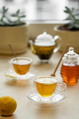 tea drinking in transparent glass dishes