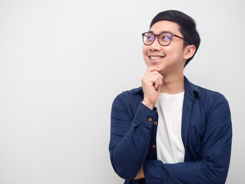 Asian Man Wearing Glasses Happy Smile Gesture Dreamy Looking At Copy Space White Background