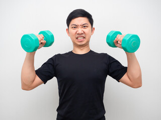 Fototapeta na wymiar Asian man holding drumbbell for workout confident face