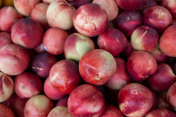 Nectarine, (Prunus persica), smooth-skinned peach sold at the city market
