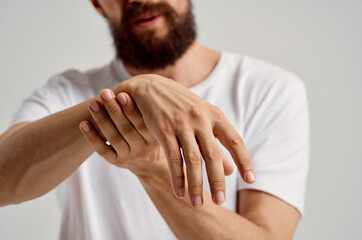 man holding hand injury pain health problem