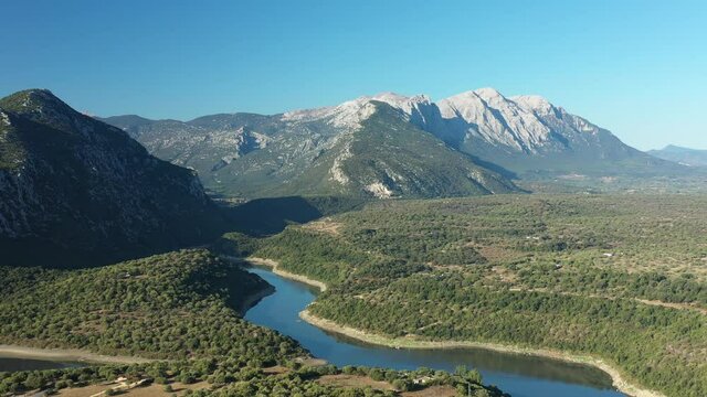 View from above, stunning aerial view of the Cedrino Lake - Lago del Cedrino, surrounded by the mountain range of Supramonte located northeast of the Gennargentu massif. Sardinia, Italy.