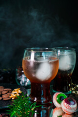 Halloween drink with eye and horror prop