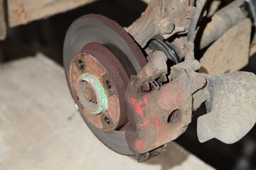 Car brake system repair - used unvented brake disk with brake caliper with brake pads