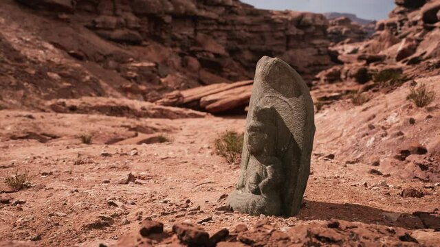 Ancient Statue on the Rocks Desert
