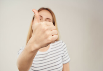 blonde woman in a striped T-shirt advertising Lifestyle Studio