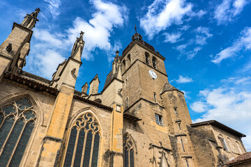 Fototapeta premium Saint-Antoine-L'abbaye clock tower underneath view, one of the most beautiful french village.