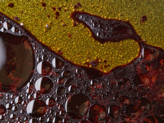 abstract background with black drops of water and oil, multi-colored background