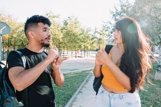 Sign Language: 2 Hispanic And African American Student Friends Deaf Talking With Nonverbal Communication. Latinx Deafness Conversation.