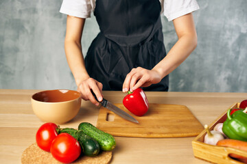 Woman in black apron Cooking healthy eating cutting board