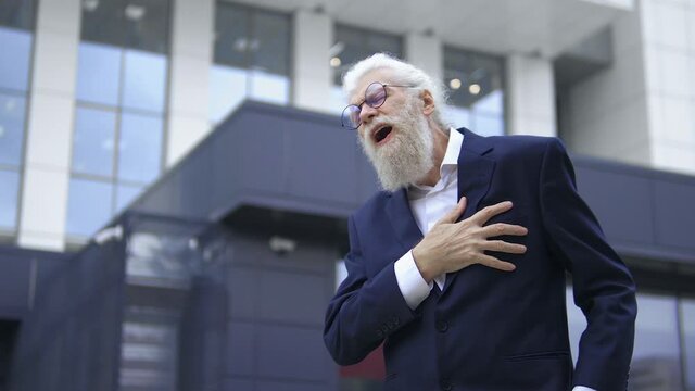Sick mature man screaming touching sore chest, heart attack, emergency situation
