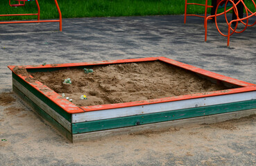 Empty Children's sandbox with crafts and flowers, Russia