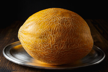 Obraz premium Melon, honey melon on wooden table background.
