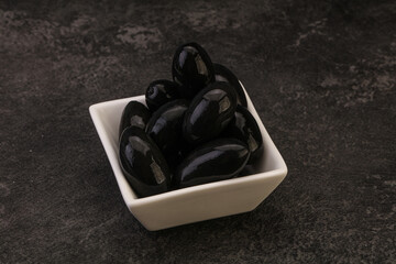 Pickled black olives in the bowl