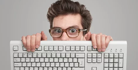 Fotobehang Funny geek man with keyboard © kegfire