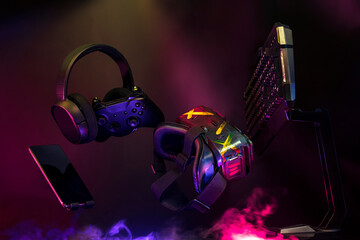 gamer devices for playing game by joystick with computer headphone and mouse on neon glow, gaming and esports challenge, streaming online, tournament concept