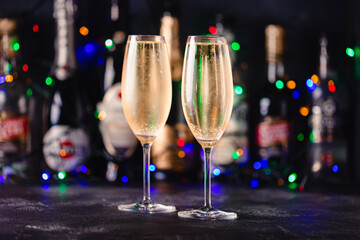 Champagne glasses on a dark background.