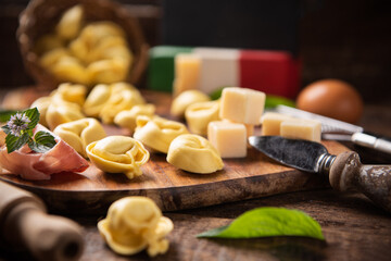 Homemade italian tortellini pasta on wooden table