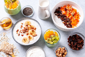 Overnight oats with fruits and nuts on concrete table top