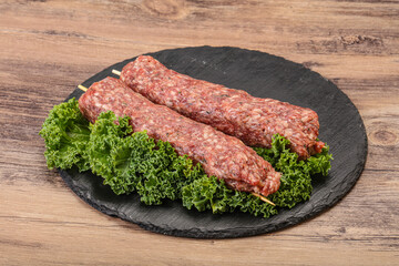 Raw minced beef kebab skewer