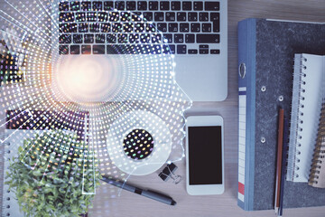 Double exposure of brain drawing over work table desktop. Top view. Global data analysis concept.