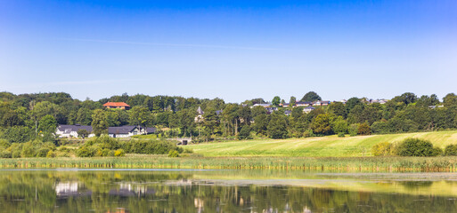 Fototapeta na wymiar Panorama of houses on the hill in the landscape of Hobro, Denmark