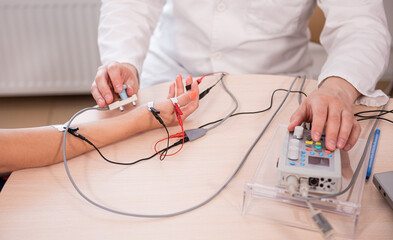 Patient nerves testing using electromyography at medical center