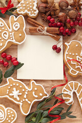 Christmas decoration with cookies and spices around note paper