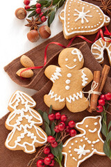 Gingerbread cookies and christmas spices on a brown napkin. Homemade Christmas cookies for kids
