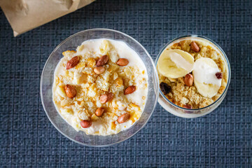 Delicious and healthy yogurt dessert with banana, biscuits and nuts.