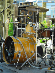 Concert stage: musical instruments, drums, amplifiers, speakers, microphones, cables