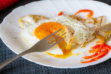 Scrambled eggs on a plate close-up. Delicious and healthy breakfast.