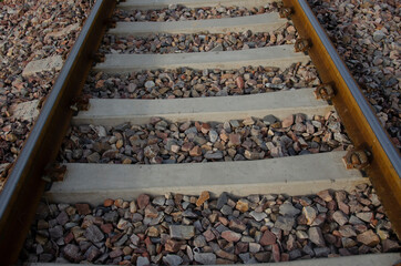 Selective focus on RAILWAY TRACK WITH STONES for transportation. Train track.
