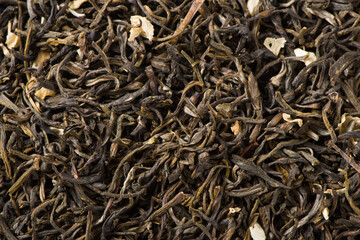 dried jasmine scented tea leaf texture background