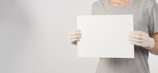 blank empty paper in woman hand and wear medical glove on white background.