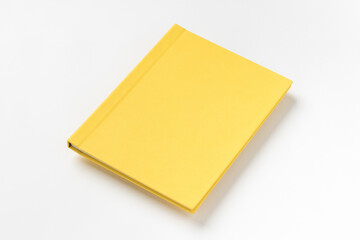 Yellow hardcover book, isolated on white background