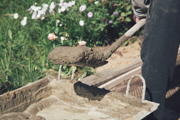 Cementing garden paths on top of metal mesh, construction work in the garden