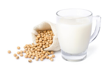 Glass of soy milk and soybeans in sack bag isolated on white background.