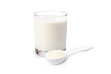 Glass of fresh milk and powdered milk or milk powder in plastic spoon isolated on white background. 