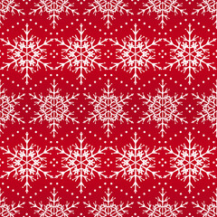 Seamless Scandinavian winter pattern. White snowflakes on a red background.