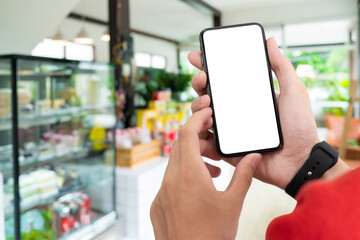 Man holding smart phone with blurred background. For Graphic display montage