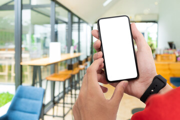 Man holding smart phone with blurred background. For Graphic display montage