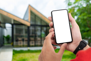 Man holding smart phone with blurred background. For Graphic display montage