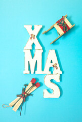 Christmas letters and wooden skis and sleds.