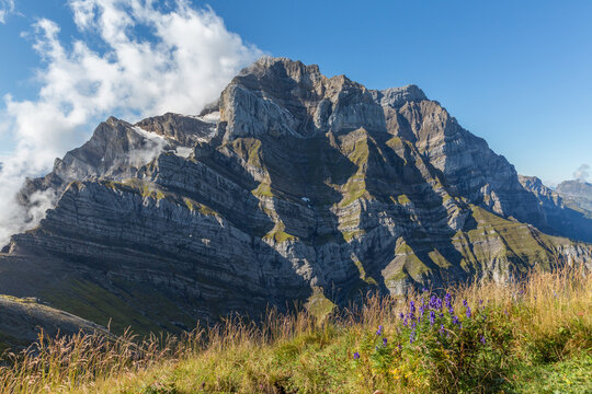 close-up of glaernisch mountain with blue sky and white cloud